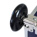 Close-up of a black wheel and metal frame on a white background